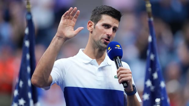Novak Djokovic holding a mike at the 2021 U.S. Open